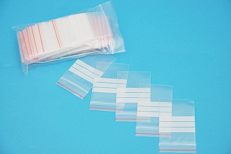 PLASTIC ZIP BAGS & PENS
