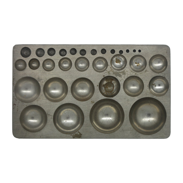 Metal dapping block with graduated round depressions for jewelry making