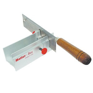 A silver-colored metal miter box with a brown wooden handle, used for cutting wax bars, rods, or tubes to precise lengths.